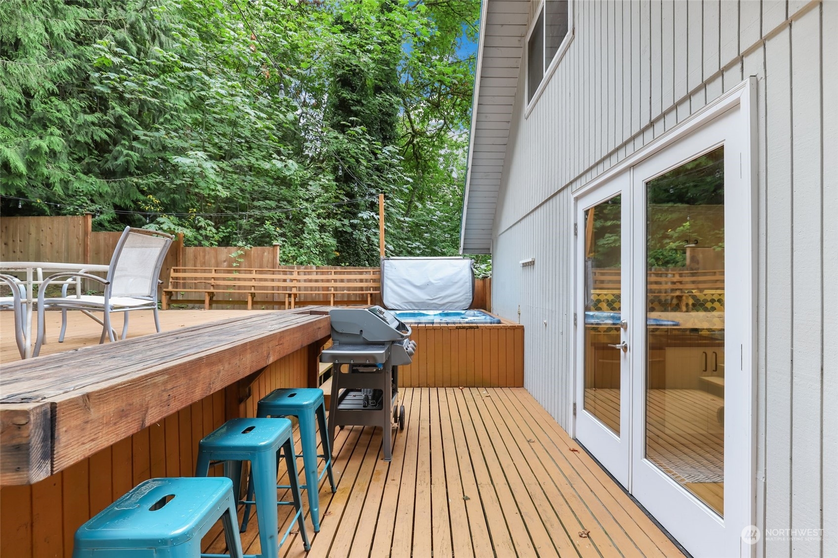 14630 200th Avenue Southeast Renton, WA 98059 - Photo 29 of 40 a view of a patio with a table and chairs