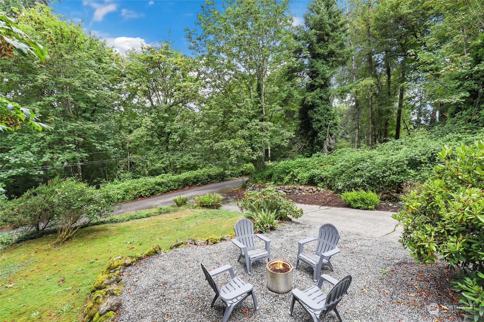 14630 200th Avenue Southeast Renton, WA 98059 - Photo 32 of 40 a view of a chair and table on the garden