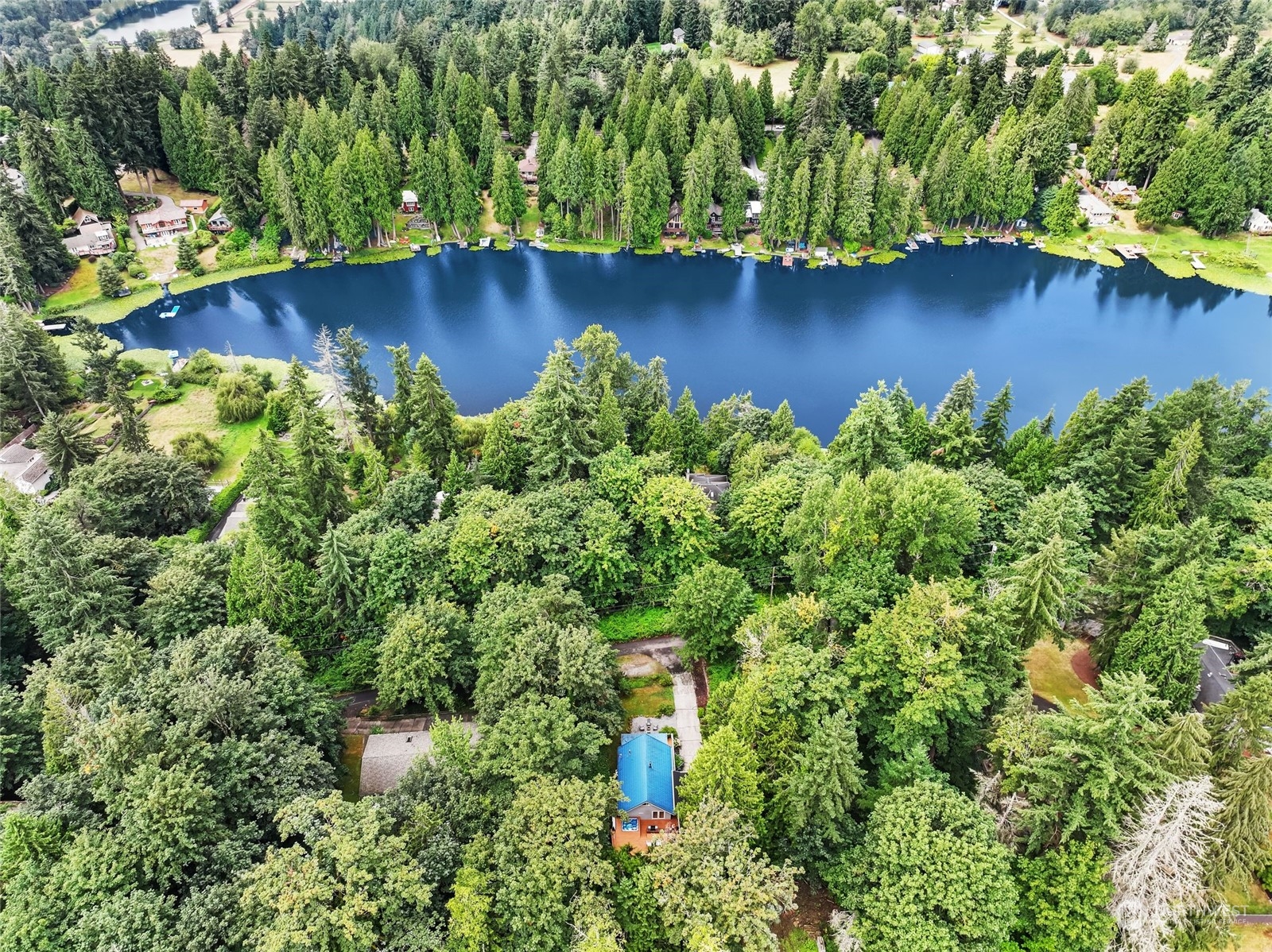 14630 200th Avenue Southeast Renton, WA 98059 - Photo 38 of 40 an aerial view of a house with swimming pool and lake view