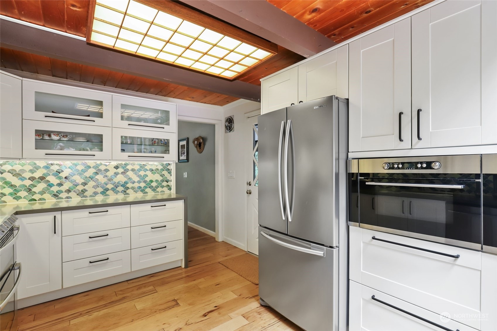 14630 200th Avenue Southeast Renton, WA 98059 - Photo 10 of 40 a kitchen with granite countertop stainless steel appliances and wooden cabinets