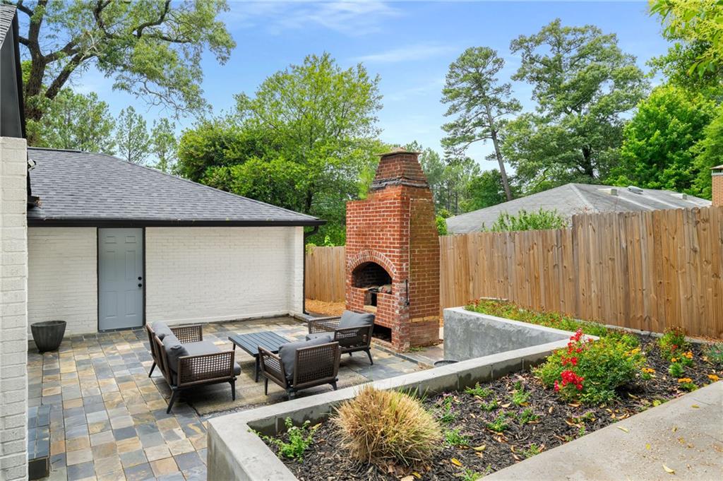 3154 North Druid Hills Road Northeast Decatur, GA 30033 - Photo 15 of 84 a view of backyard with outdoor seating and green space