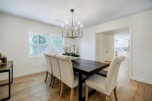 a kitchen with a refrigerator stove and cabinets