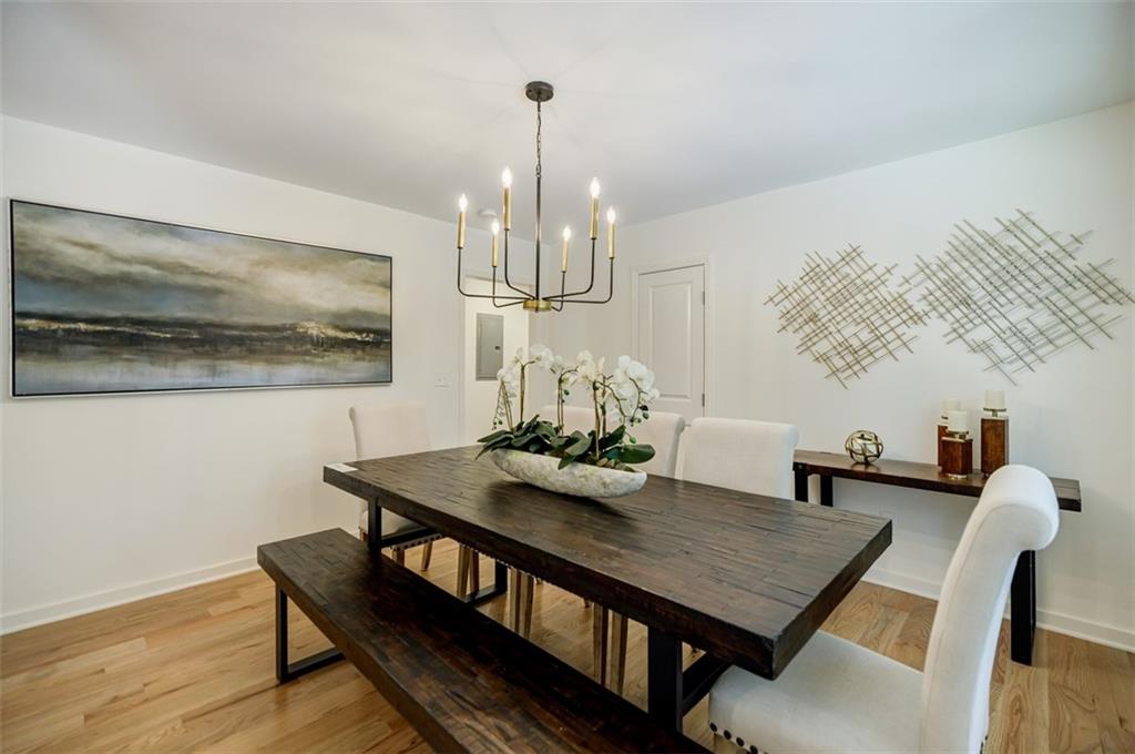 3154 North Druid Hills Road Northeast Decatur, GA 30033 - Photo 30 of 84 a view of a dining room with furniture and wooden floor