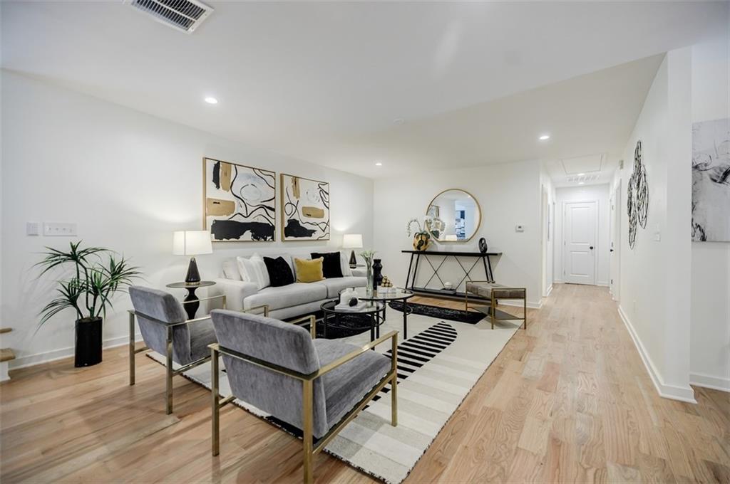3154 North Druid Hills Road Northeast Decatur, GA 30033 - Photo 32 of 84 a living room with furniture and a wooden floor