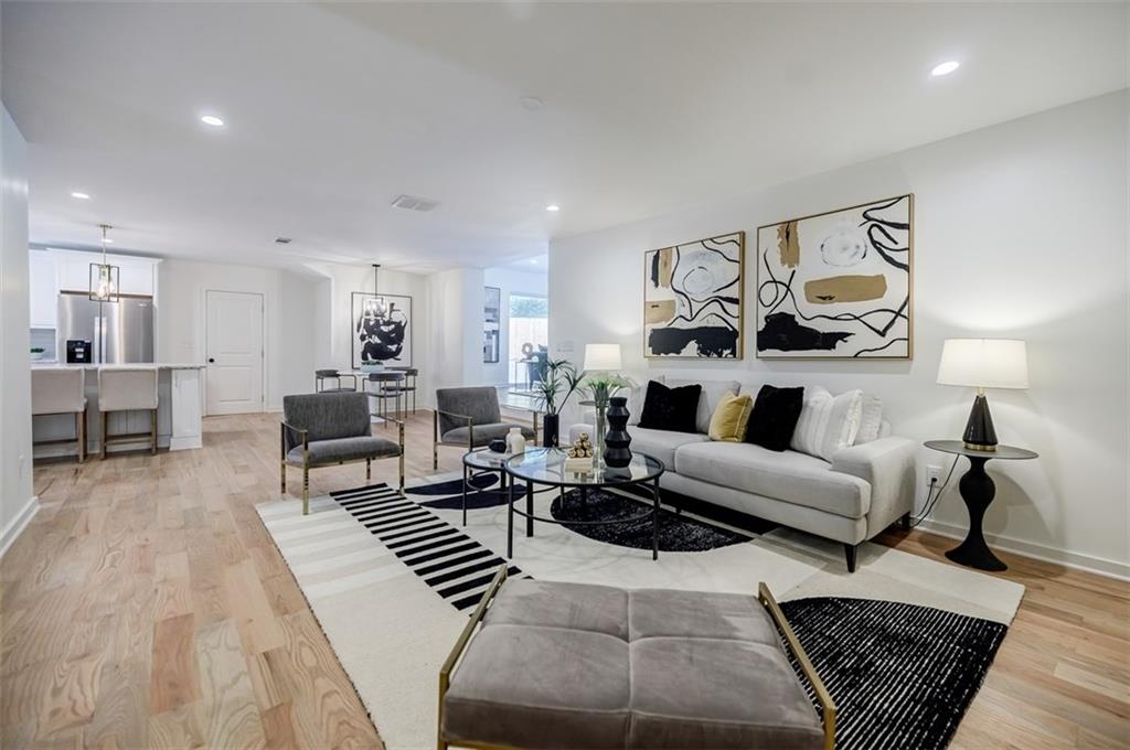 3154 North Druid Hills Road Northeast Decatur, GA 30033 - Photo 33 of 84 a living room with furniture and a wooden floor