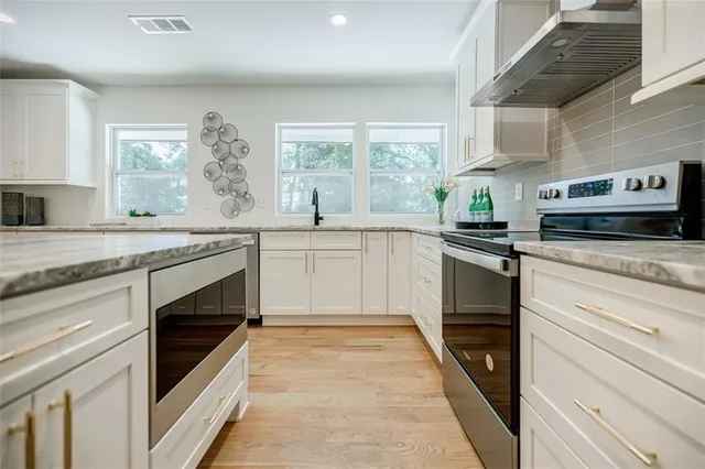 a view of a livingroom with furniture and wooden floor