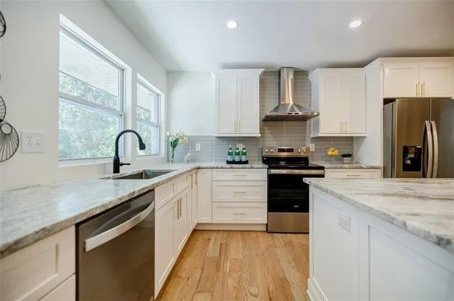 a bathroom with a sink vanity and a mirror