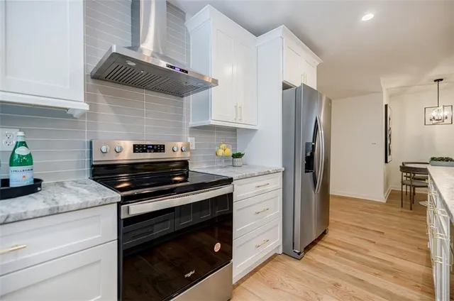 a view of an empty room and wooden floor