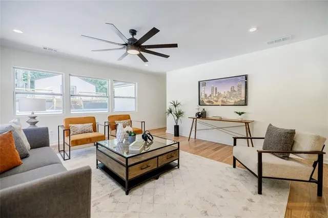 a white bath tub sitting next to a white wall