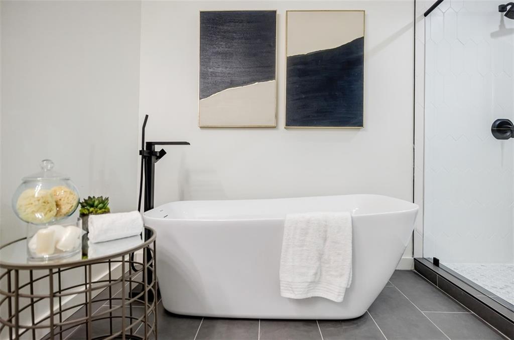 3154 North Druid Hills Road Northeast Decatur, GA 30033 - Photo 69 of 84 a white bath tub sitting next to a white wall