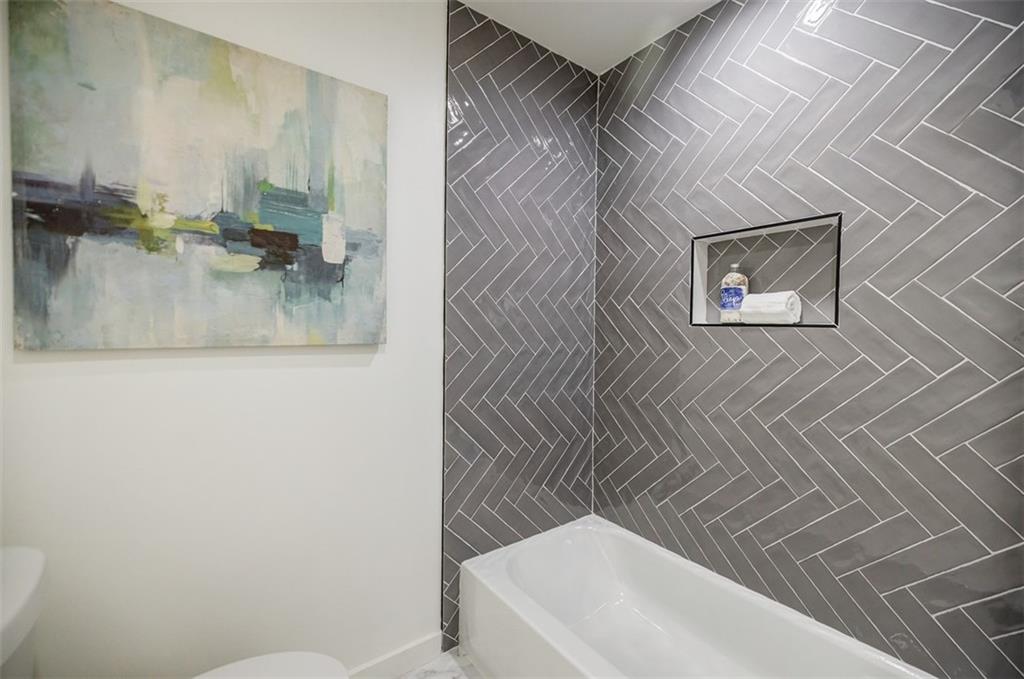 3154 North Druid Hills Road Northeast Decatur, GA 30033 - Photo 82 of 84 a bathroom with a bathtub and a sink