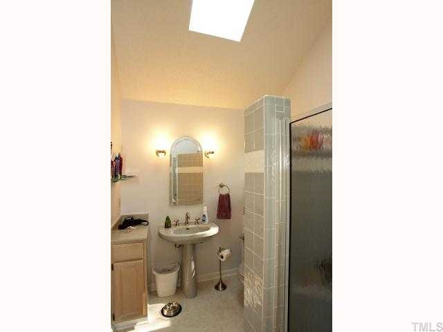 4304 Knightsbridge Way Raleigh, NC 27604 - Photo 8 of 12 a bathroom with a sink and a mirror
