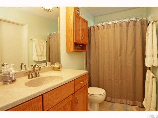 4304 Knightsbridge Way Raleigh, NC 27604 - Photo 10 of 12 a bathroom with a sink a toilet and shower