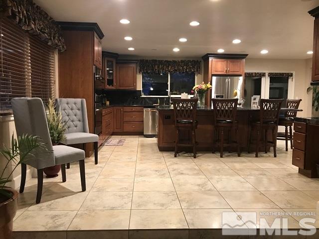 1435 Celese Lane Reno, NV 89511 - Photo 11 of 40 a kitchen with a table and chairs
