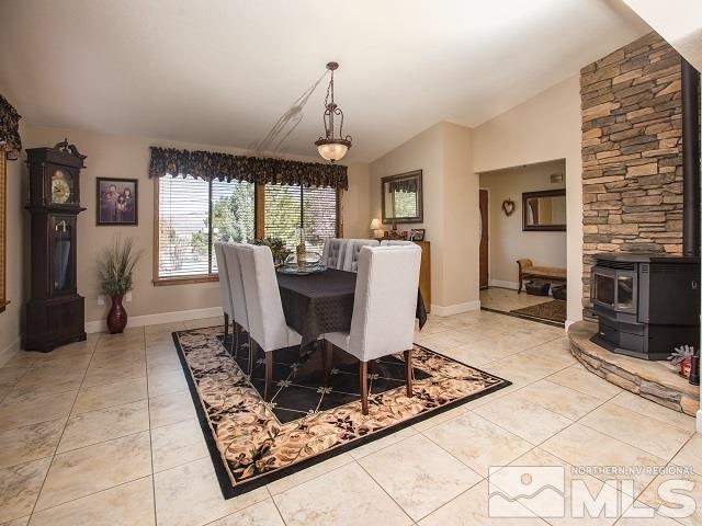 1435 Celese Lane Reno, NV 89511 - Photo 15 of 40 a living room with furniture a window and a fireplace