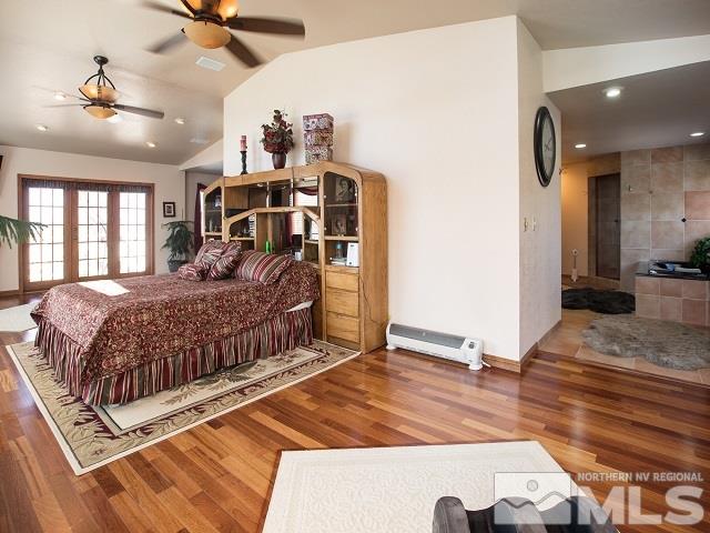 1435 Celese Lane Reno, NV 89511 - Photo 17 of 40 a bedroom with a bed and a large mirror on the dresser