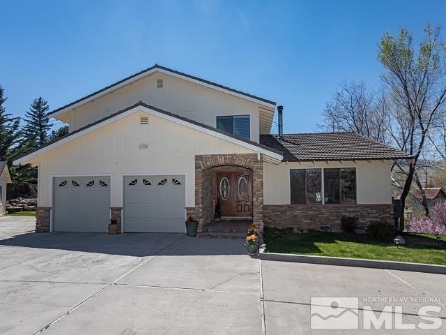 1435 Celese Lane Reno, NV 89511 - Photo 2 of 40 a view of a house with a yard