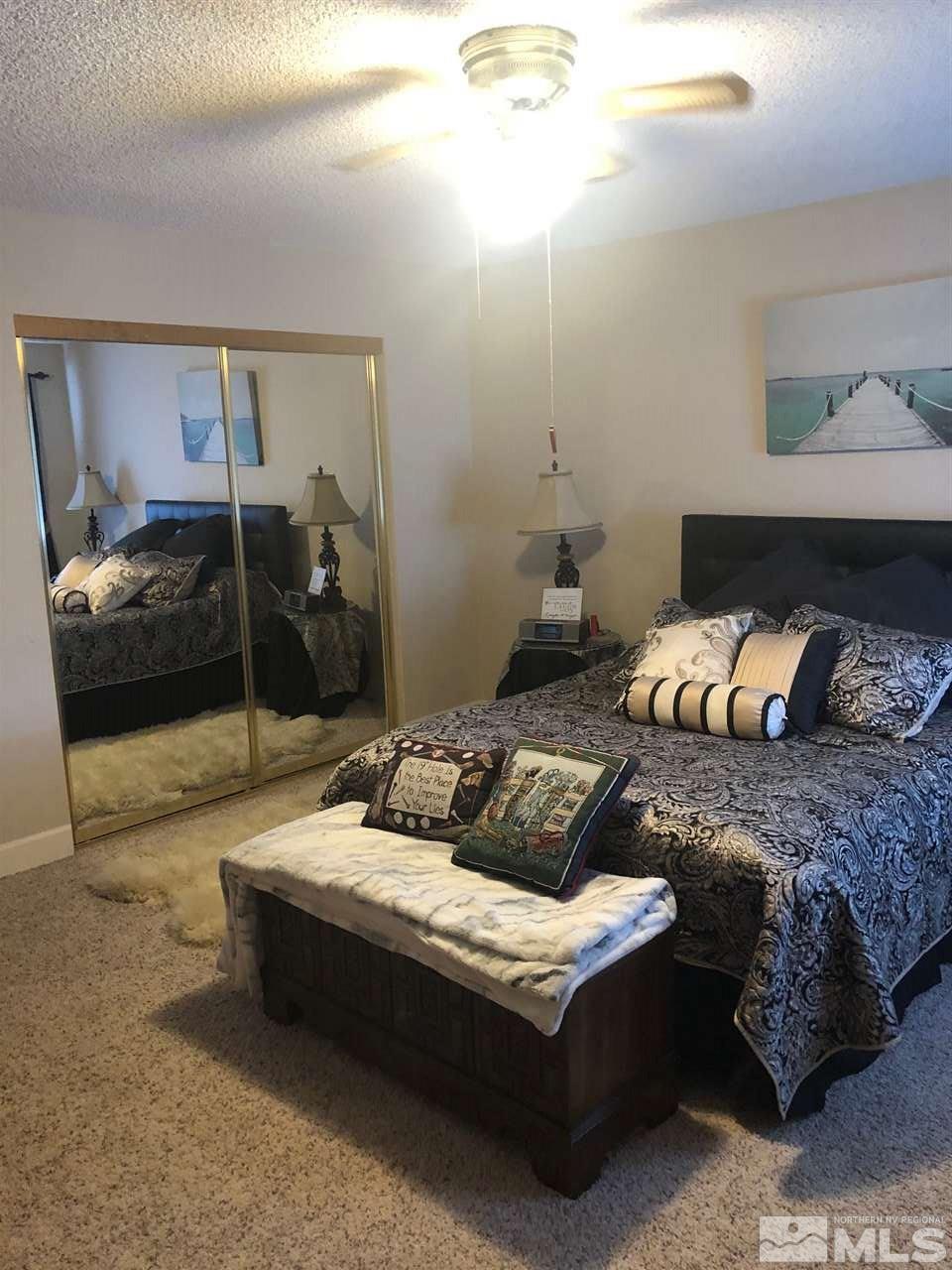 1435 Celese Lane Reno, NV 89511 - Photo 21 of 40 a living room with furniture and a table