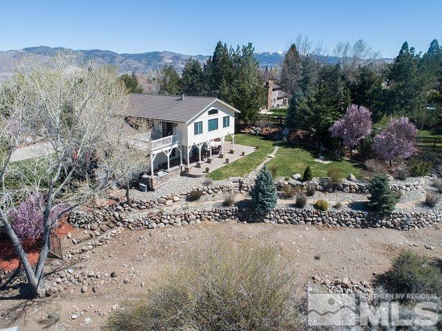 1435 Celese Lane Reno, NV 89511 - Photo 29 of 40 a view of a house with a yard