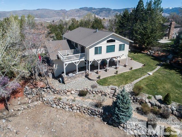 1435 Celese Lane Reno, NV 89511 - Photo 30 of 40 a view of a house with a yard