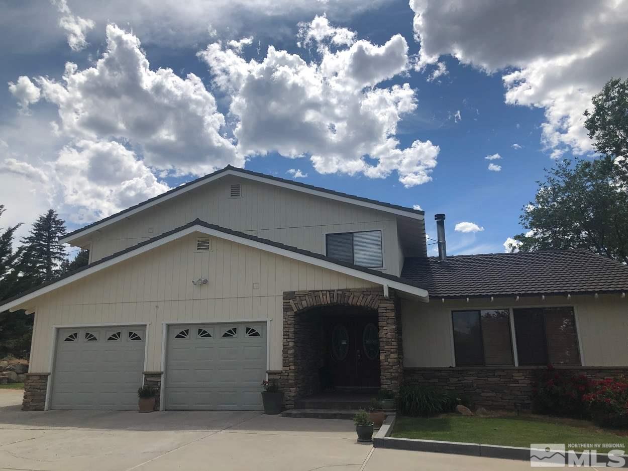 1435 Celese Lane Reno, NV 89511 - Photo 3 of 40 a view of a house with a tree