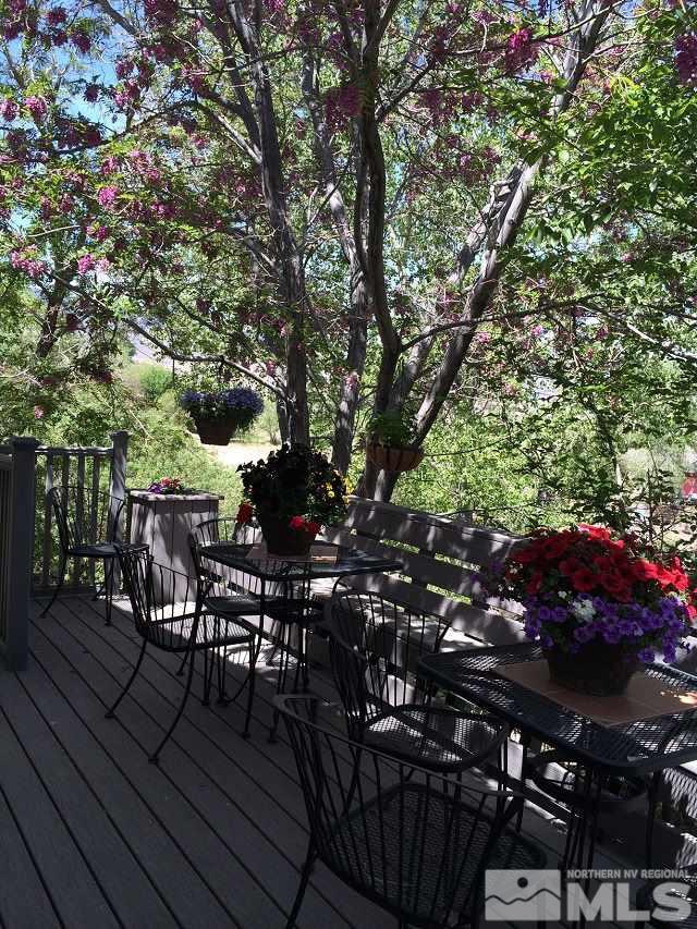 1435 Celese Lane Reno, NV 89511 - Photo 31 of 40 a view of a chairs and table on the wooden roof deck