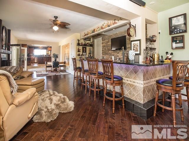 1435 Celese Lane Reno, NV 89511 - Photo 8 of 40 a living room with furniture a flat screen tv and kitchen view