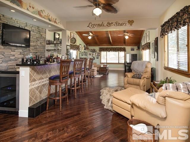 1435 Celese Lane Reno, NV 89511 - Photo 9 of 40 a living room with furniture and a flat screen tv