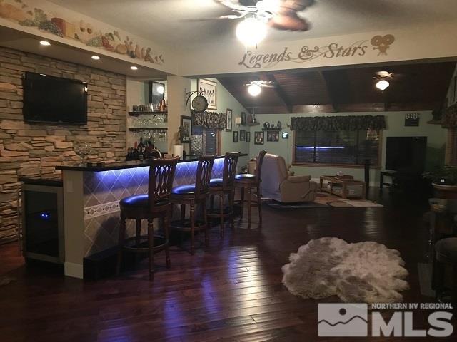1435 Celese Lane Reno, NV 89511 - Photo 10 of 40 a kitchen with stainless steel appliances dining table and chairs