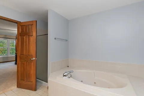 a reading room with furniture and a window