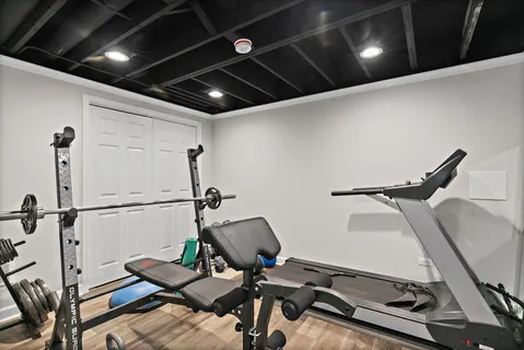a bathroom with a double vanity sink toilet mirror and shower