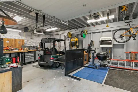 an aerial view of a house with a garden and yard
