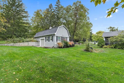 a view of a lake with a yard