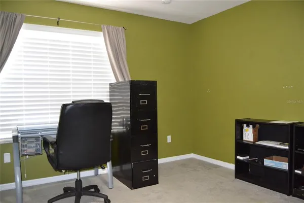 a view of a livingroom with a workspace