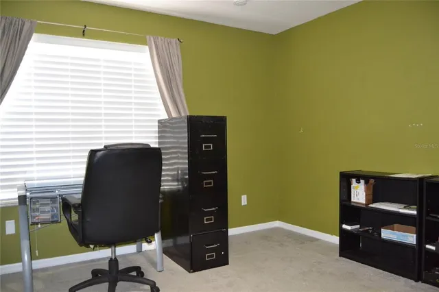 a view of a livingroom with a workspace