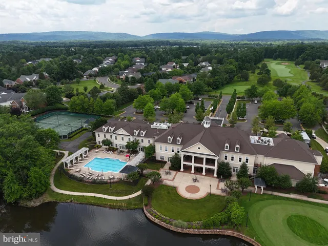 a view of a swimming pool with a yard