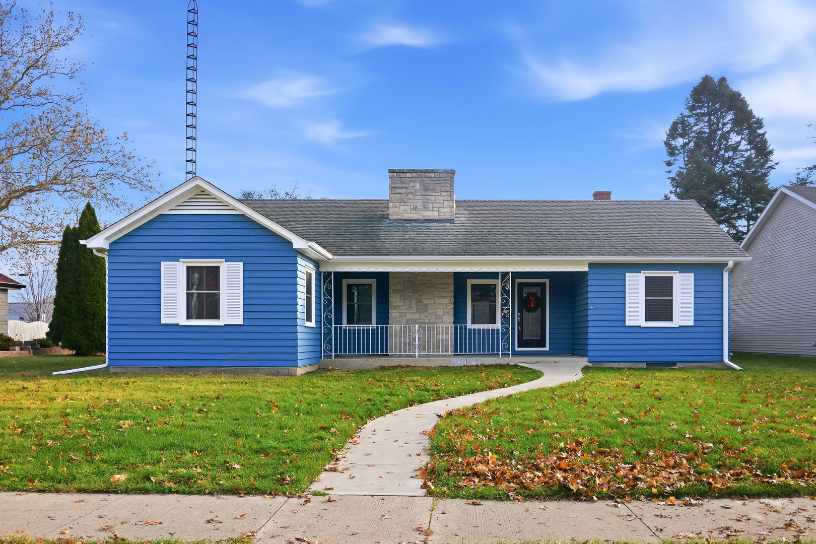 a front view of a house with a garden