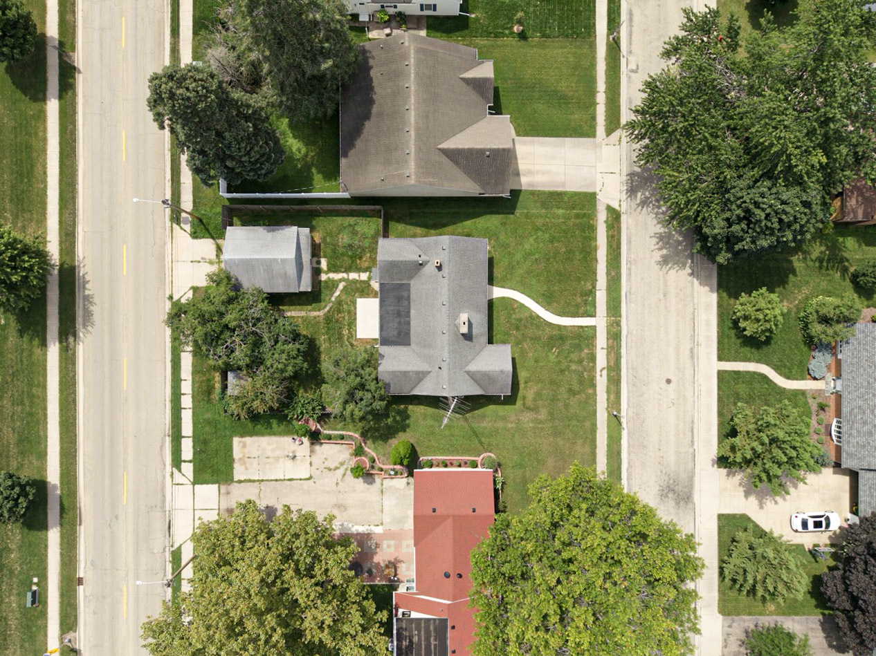 1209 Tilton Park Drive Rochelle, IL 61068 - Photo 21 of 26 an aerial view of a house with outdoor space and street view