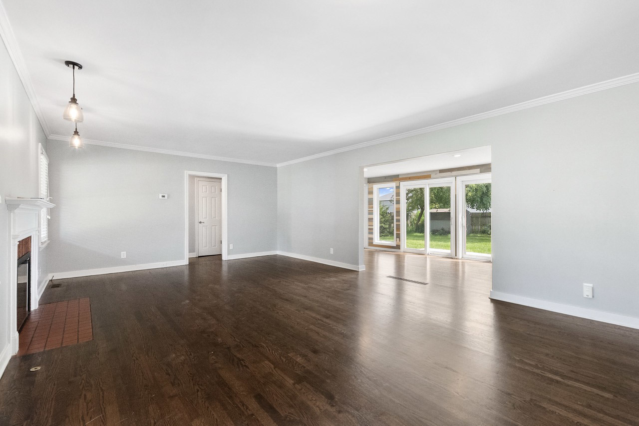 1209 Tilton Park Drive Rochelle, IL 61068 - Photo 5 of 26 a view of empty room with wooden floor and fan