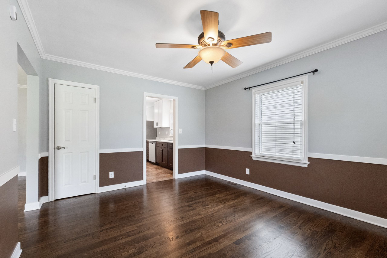 1209 Tilton Park Drive Rochelle, IL 61068 - Photo 7 of 26 a view of an empty room with wooden floor and a window
