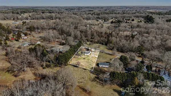 an aerial view of residential house with outdoor space