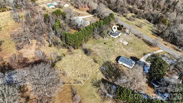 a aerial view of a house with a yard