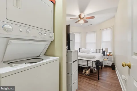 a balcony with wooden floor and fence