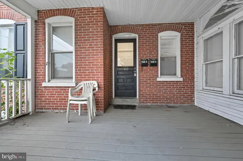 a view of an outdoor space with porch and furniture