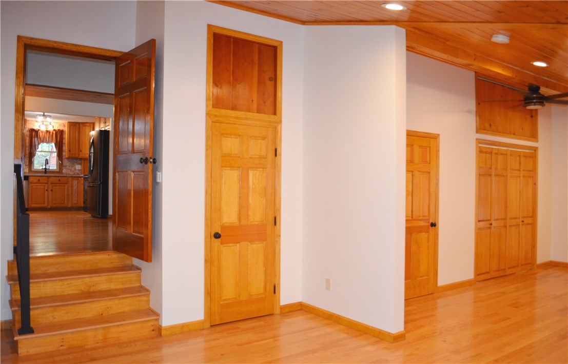 22 Weaver Hill Road Coventry, RI 02816 - Photo 20 of 41 New family room, cedar closet, 1/2 bath and laundry closet with storage above all!