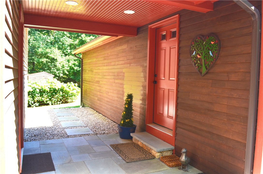 22 Weaver Hill Road Coventry, RI 02816 - Photo 32 of 41 Portico leading from house (family room to garage)