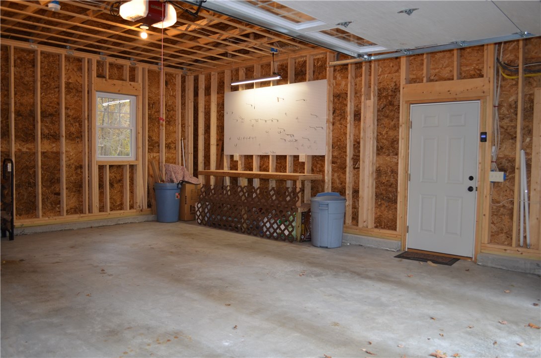22 Weaver Hill Road Coventry, RI 02816 - Photo 33 of 41 Oversized 2 car garage with workbench