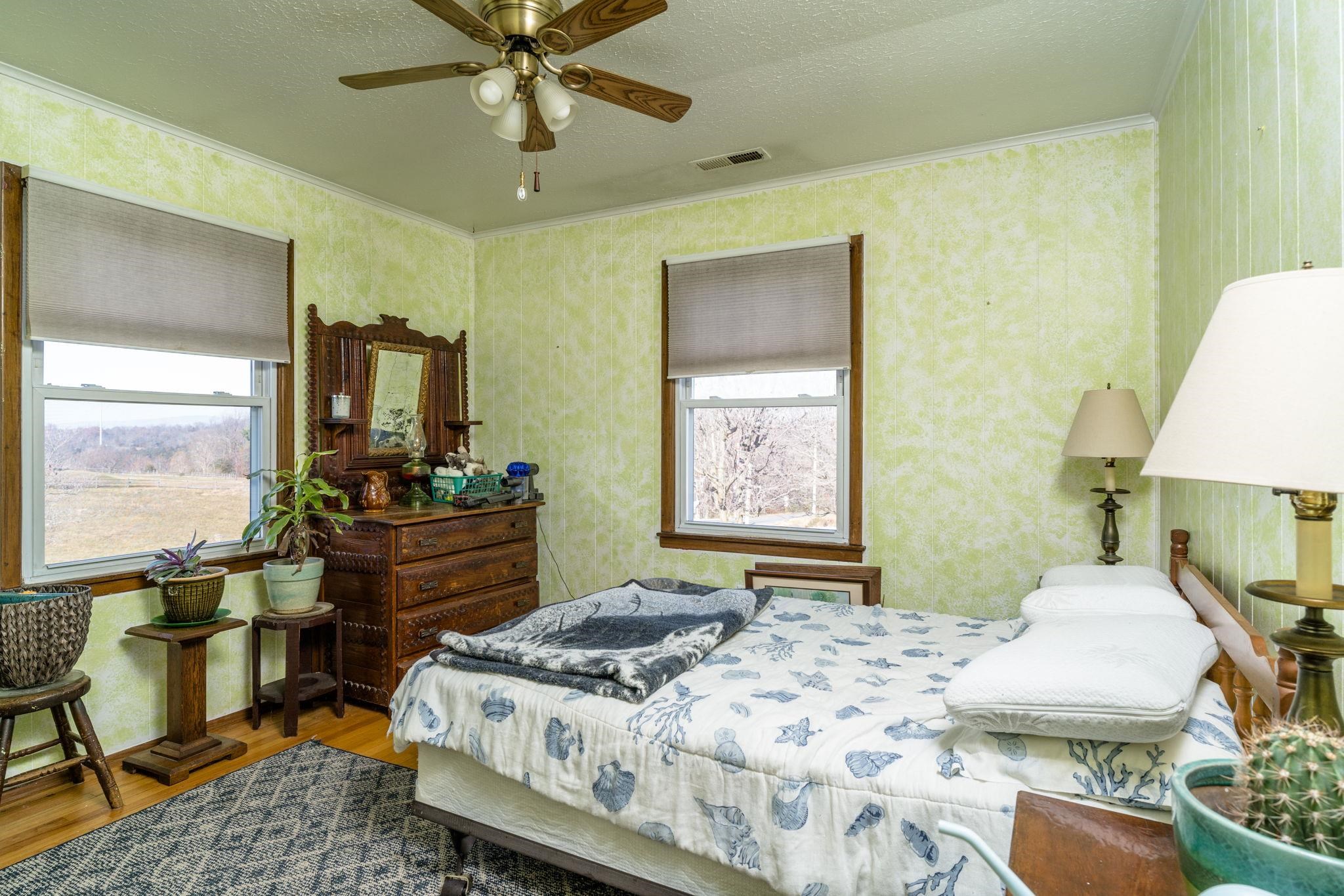 3154 Layman Trestle Road Harrisonburg, VA 22802 - Photo 11 of 30 a bedroom with a bed table chair and a window