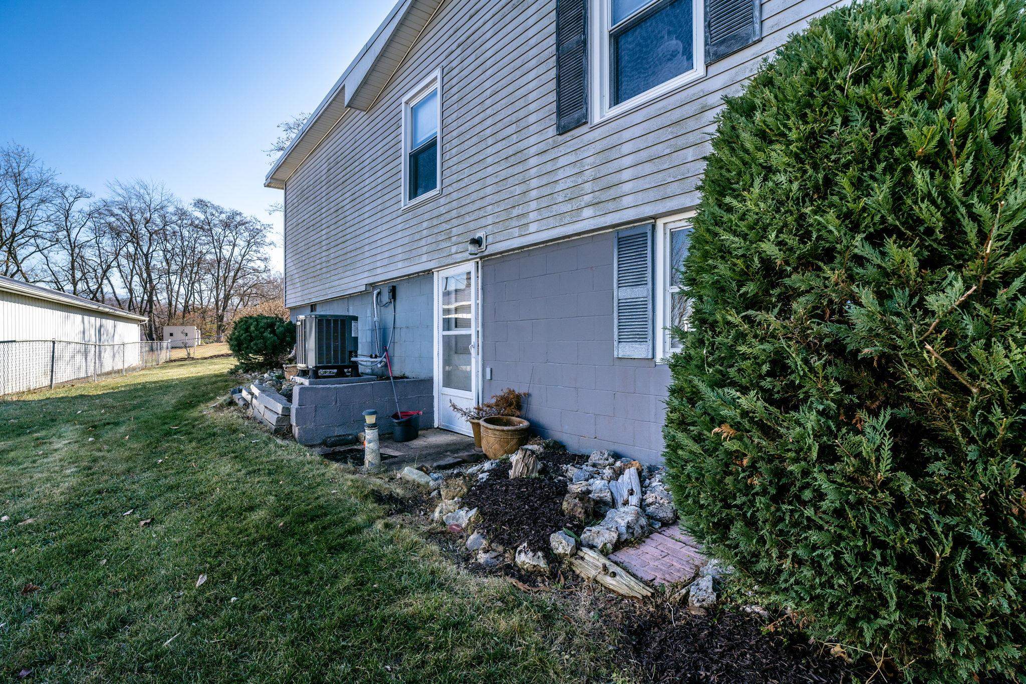 3154 Layman Trestle Road Harrisonburg, VA 22802 - Photo 24 of 30 a backyard of a house with table and chairs