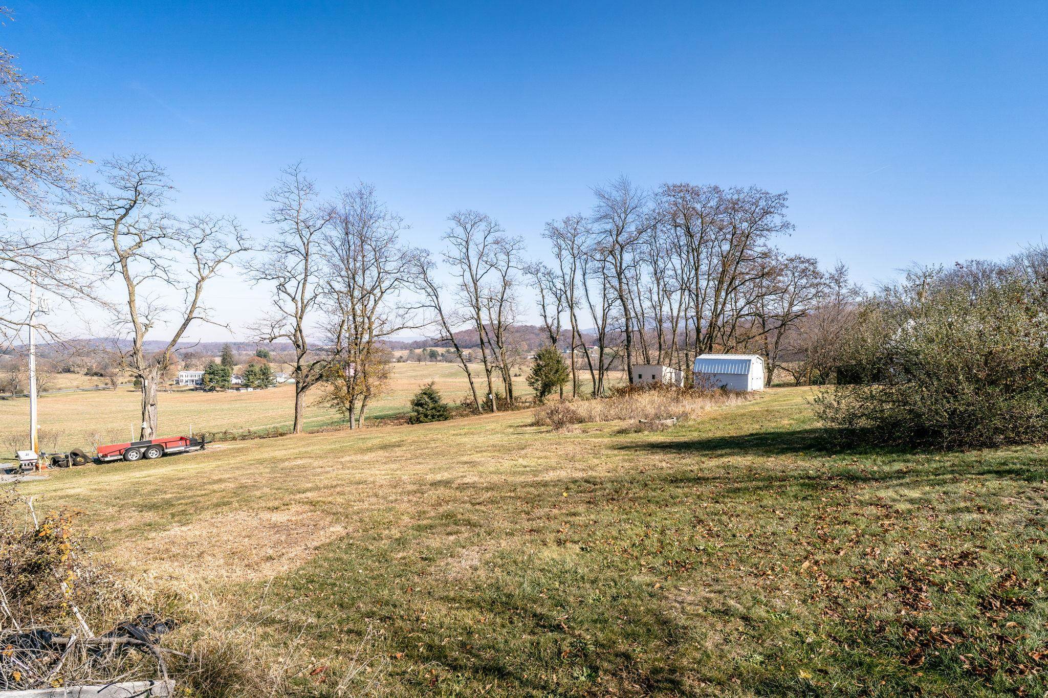3154 Layman Trestle Road Harrisonburg, VA 22802 - Photo 25 of 30 a view of a yard with yellow lighting on it